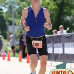 Near the end of the running leg. I didn't like the 5 K course very much: it was an out and back course that really wound around a residential neighborhood. It was pretty warm at this point too but a number of people had sprinklers out to help us cool off.